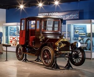 An antique Model T on display at a museum.